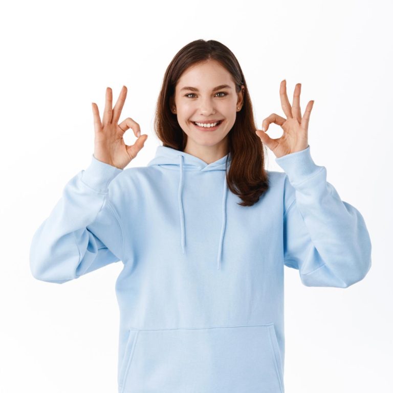 young-girl-student-say-yes-showing-okay-signs-approval-accept-something-good-praise-choice-woman-show-ok-gesture-as-like-compliment-thing-standing-white-background